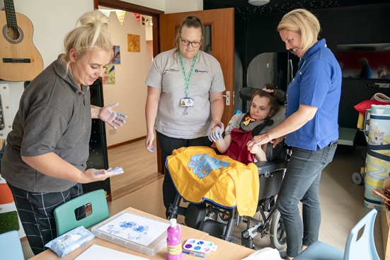 Demelza East Sussex hospice helping a child with a hand print