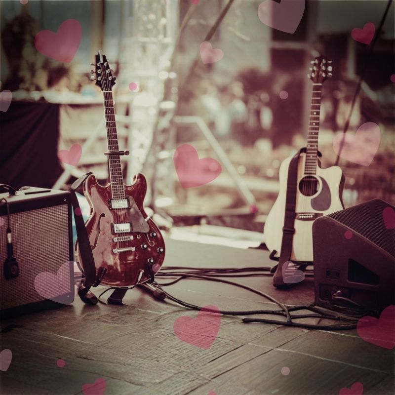 Two guitars and amps on a stage to represent concert performed in aid of hospice fundraising