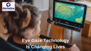 young child using eye gaze assistive technology to operate screen based game